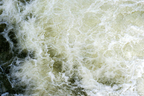 istock Mountain river water waves and bubbles. Water background and texture 589117056