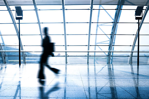 istock airfield with air planes through glass window 589117138