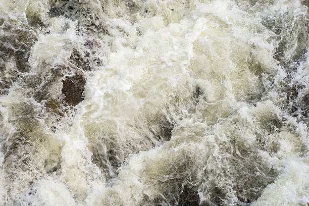 istock Mountain river water waves and bubbles. Water background and texture 589117144