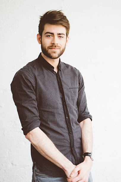 istock Portrait of a cheerful young man 589118928