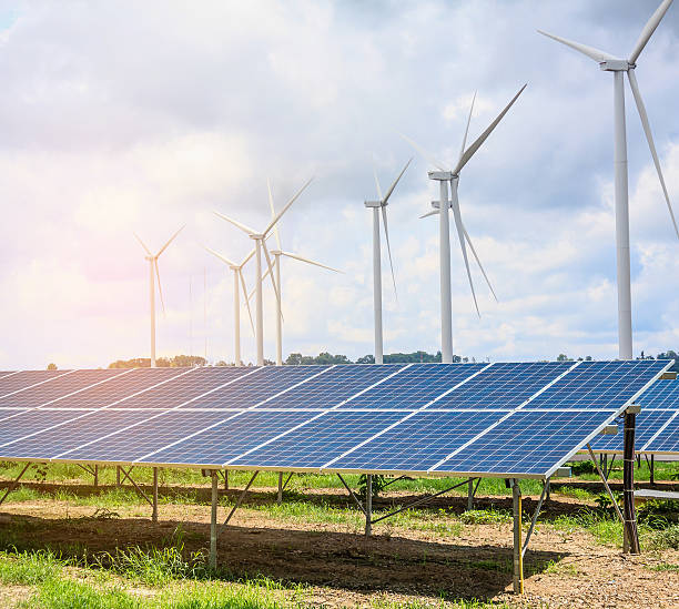 istock solar panels and wind turbines with the clouds and sky 589119920