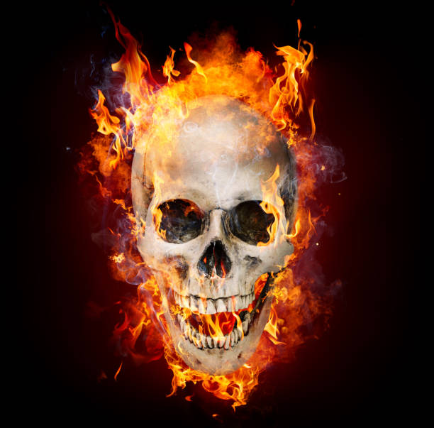 istock Satanic Skull In Flames In The Darkness 589123530