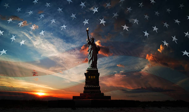 Independence day. Liberty enlightening the world Statue of Liberty on the background of flag usa and sunrise independence day holiday photos stock pictures, royalty-free photos & images