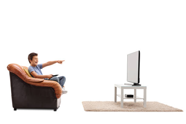 istock Child watching something hilarious on TV 589125924
