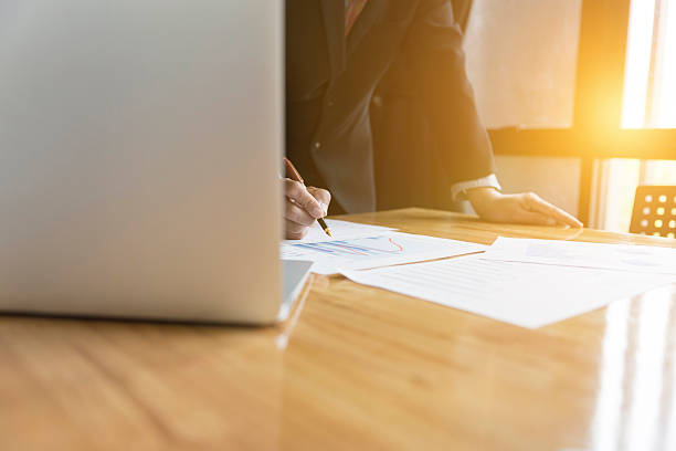 istock businessman in suit analyze market analysis business chart 589127188