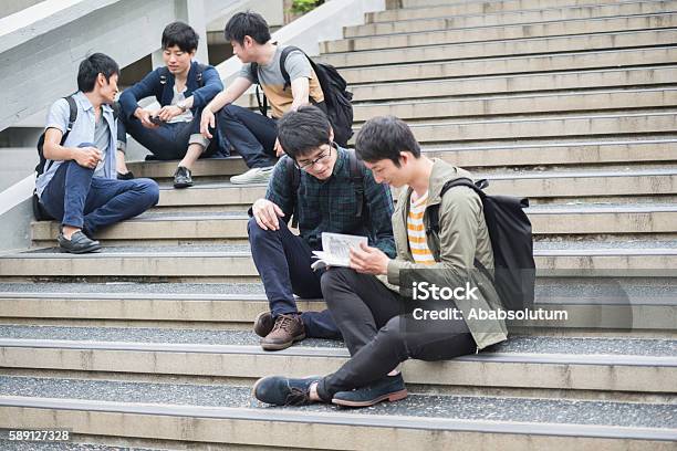 Five Japanese Students Having Fun On Staircase Campus Kyoto Japan Stock Photo - Download Image Now