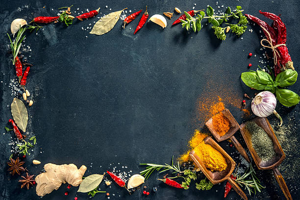 istock Herbs and spices over black stone background 589128214