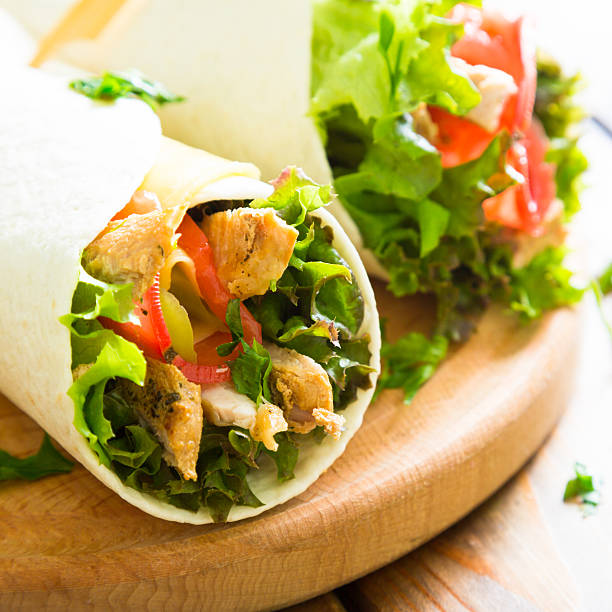 istock Meat and vegetables wrapped in a tortilla 589131036