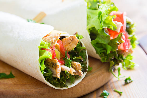 istock Meat and vegetables wrapped in a tortilla 589131568