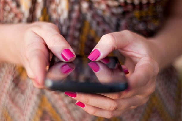 Beautiful women Surfing Internet Concept. Young beautiful women lady touching and browsing her smart phone. Woman chatting with her friends by her smartphone