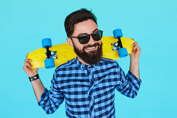 istock Young hipster man with a skateboard 589133996