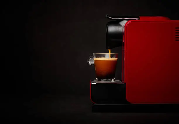 Coffee machine with cup of coffee