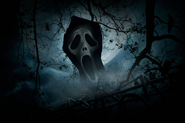 istock Ghost scream with fence over smoke and moon, Halloween concept 589137938