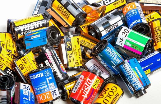 Minsk, Belarus-May 30, 2015: Bulk Variety of Old Photo Films Cassettes of Different World Leading Manufacturers Placed in Heap Together against White Background shot in Studio on May 30, 2015 in Minsk, Republic of Belarus