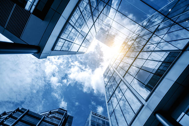istock glass skyscraper reflecting the blue sky 589416154