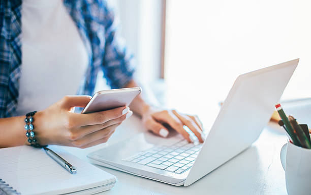 istock Young businesswoman using smart phone 589416472