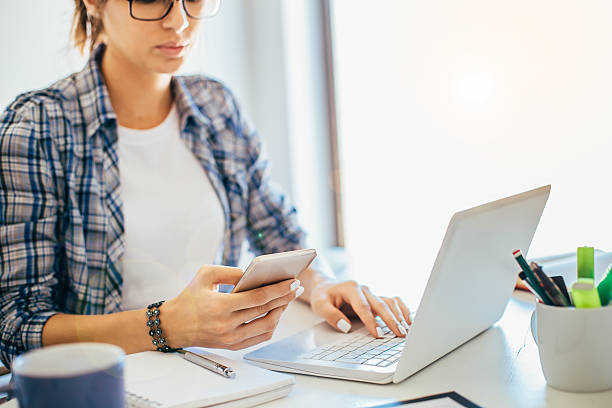 istock Young businesswoman using smart phone 589416566