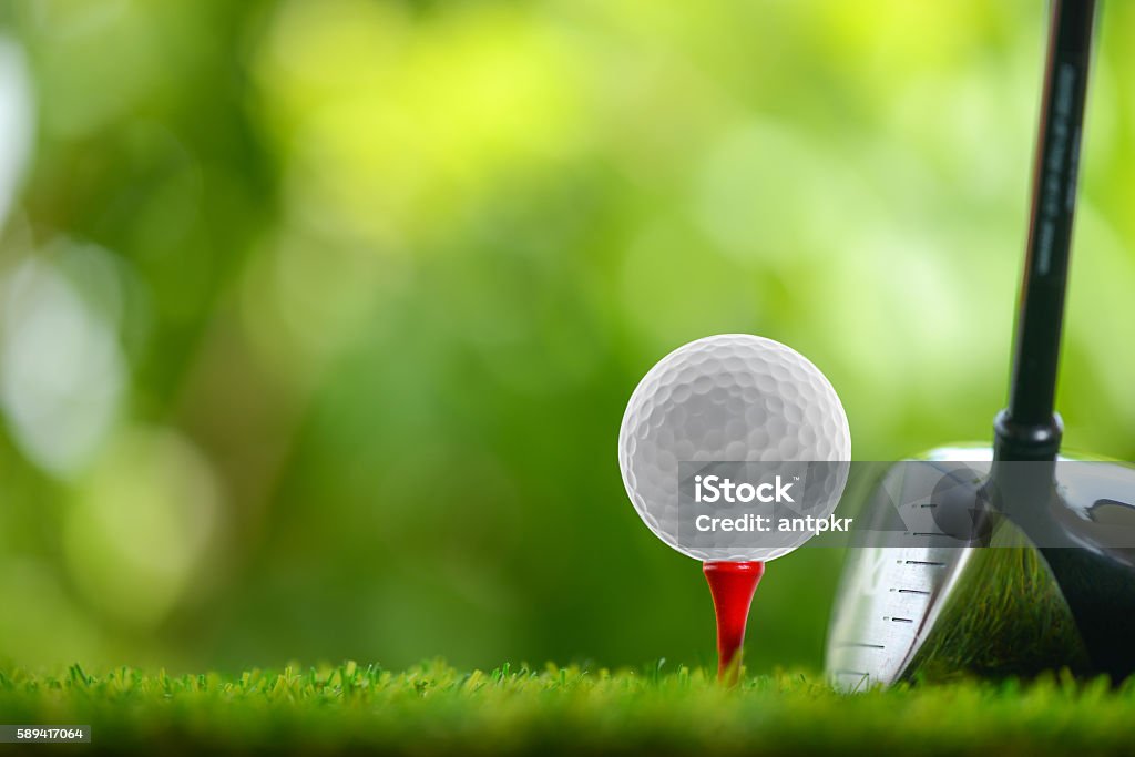 drive golf drive a golf ball on tee Golf Stock Photo