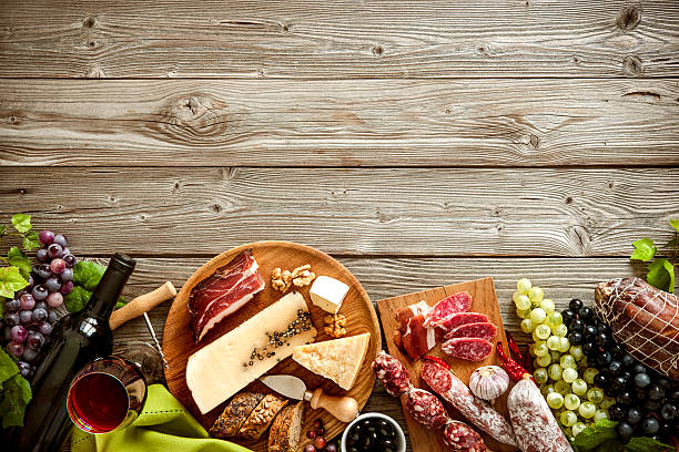 Romantic dinner with wine, cheese and traditional sausages