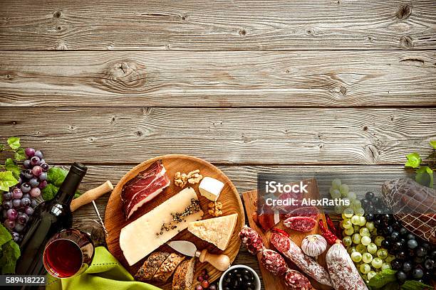 Romantic Dinner With Wine Cheese And Traditional Sausages Stock Photo - Download Image Now