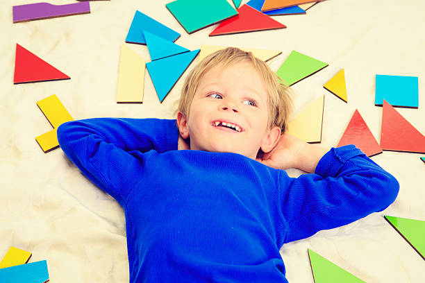 istock happy little boy with puzzle toys, early learning 589419954