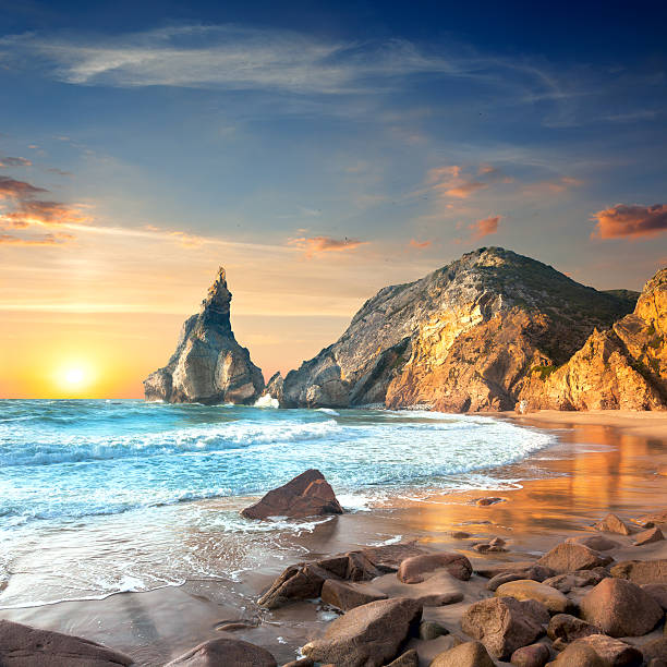 istock Ocean Landscape at Sundown time, beautiful rocks and stones beac 589421982