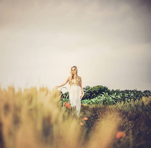 Portrait of a fashionable young woman in nature on a sunny summer day