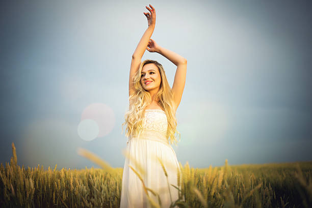 istock Beautiful blonde on the field 589424148