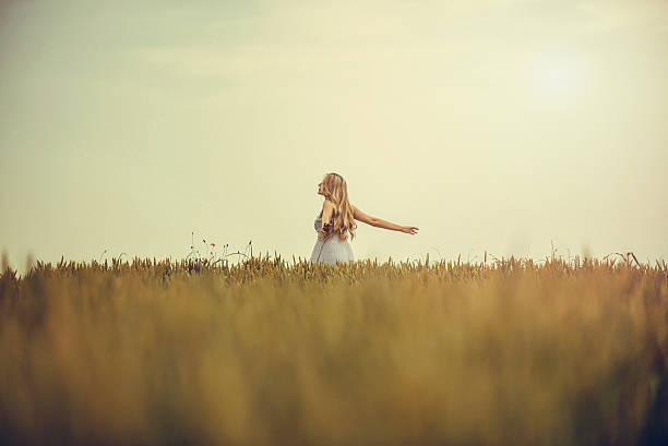 istock Beautiful blonde on the field 589424222