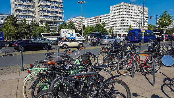 bicycles in the near of u-bahn station berlin alexanderplatz - clock station people berlin germany imagens e fotografias de stock