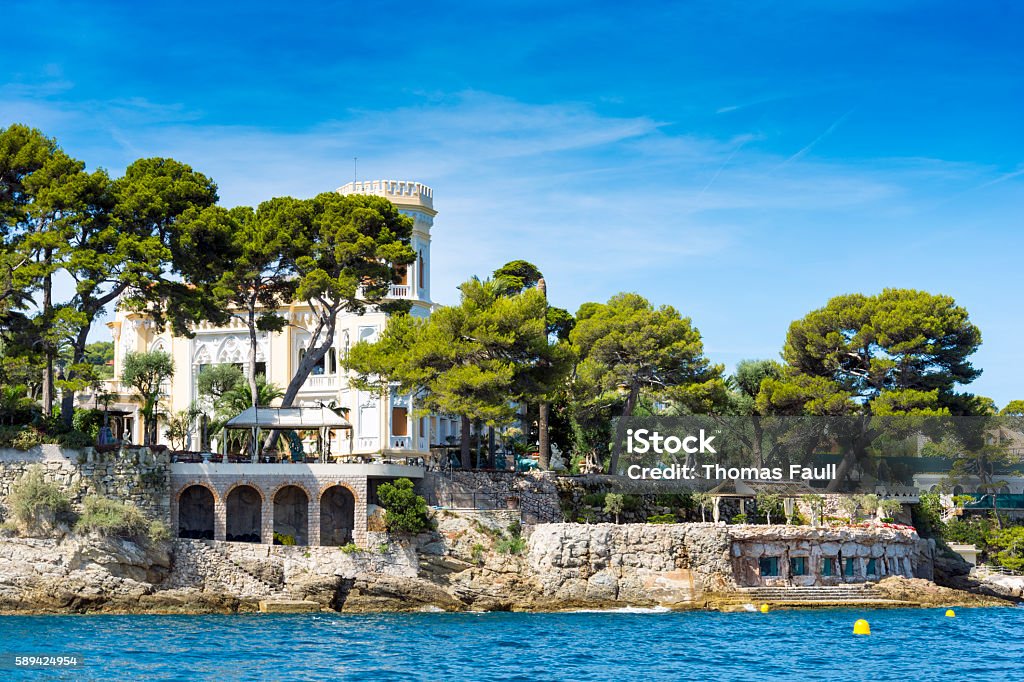 Paloma Beach Buildings, French Riviera, France Various hotel buildings along the coast by the exclusive Paloma Beach in the bay of 'Anse de la Scalette' in the south of France. Logos removed. Saint-Jean-Cap-Ferrat Stock Photo