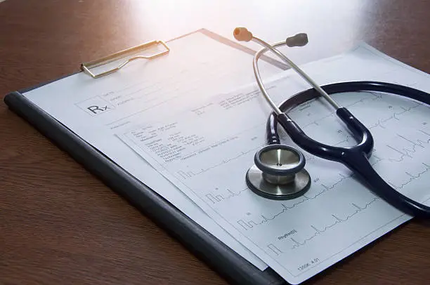 close up of stethoscope and medical prescription