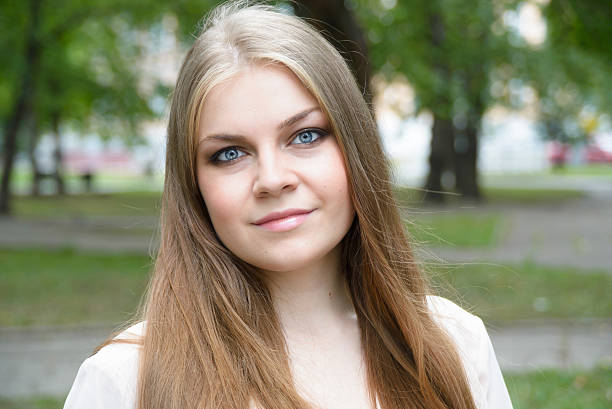 istock beautiful girl in the park 589426106