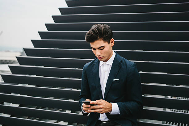 istock Japanese Entrepreneur Using a Smartphone 589427176