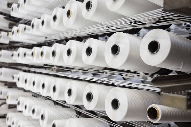 istock Detail of string reels in factory 589427708