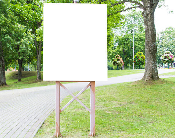 istock Vertical blank billboard in park for design and advertising mock 589429502