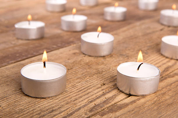 istock Candles on wooden background 589431598