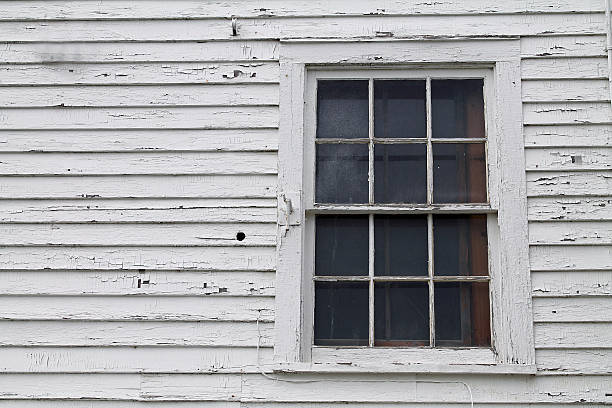 istock Closeup of a Window in an Old House 589432788