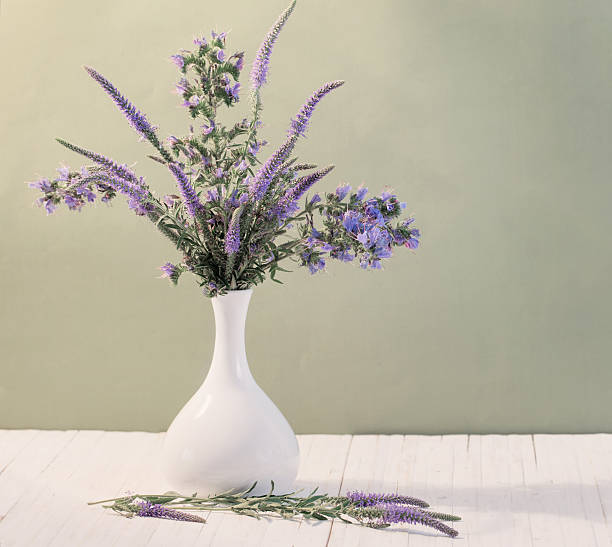 istock blue flowers in a vase 589435526