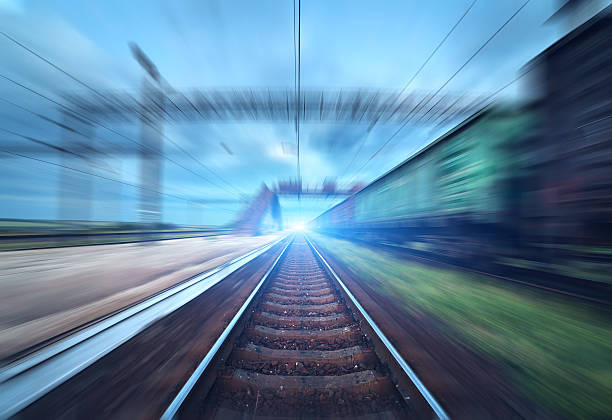 istock Railway station with cargo wagons in motion blur effect 589436114