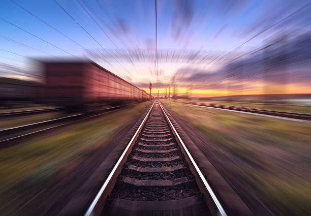 istock Railway station with cargo wagons in motion blur effect 589436206