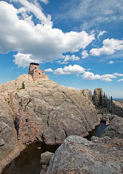 Harney Peak Fire Lookout Tower with pumphouse and small dam in Custer State Park in the Black Hills of South Dakota USA