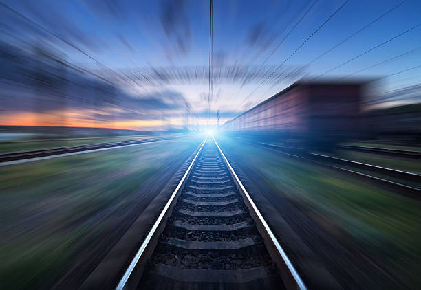 istock Railway station with cargo wagons in motion blur effect 589436262