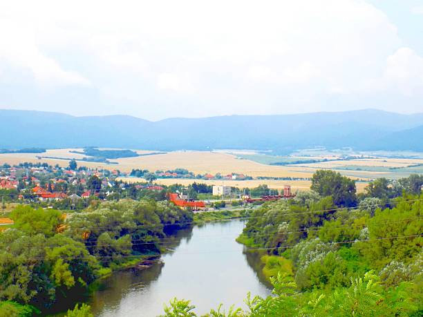 istock Village near river 589436974