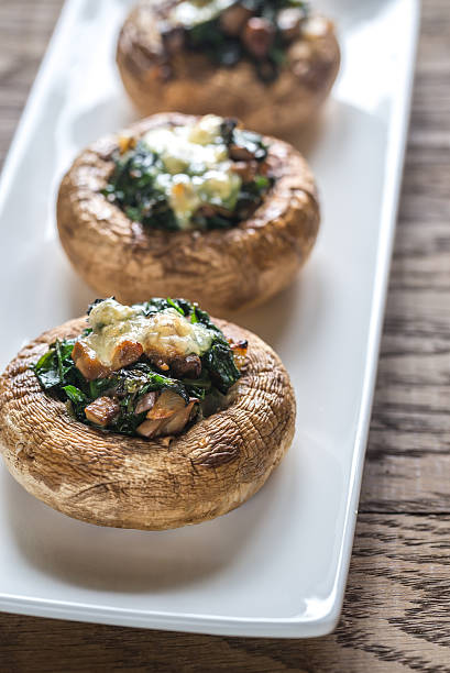 istock Baked mushrooms stuffed with spinach and cheese 589440180