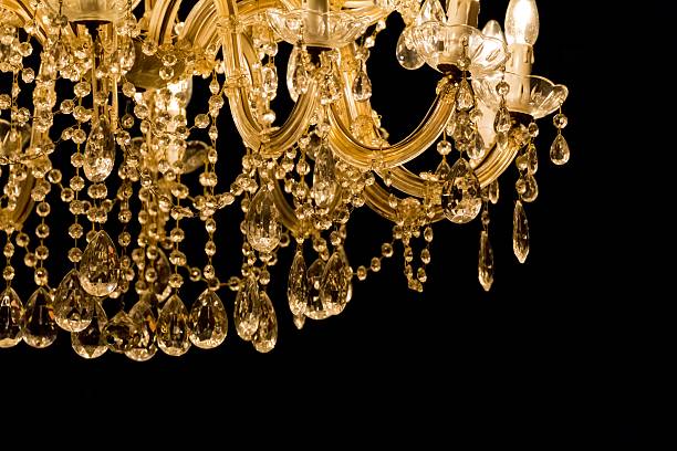 istock Luxury chandelier with light candles and right dark background 589440208