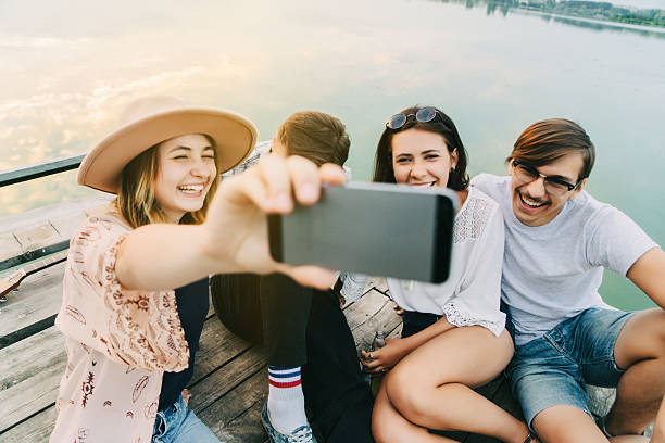 istock Friends  take selfie on pier 589442112