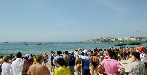 Rio de Janeiro, Brazil - August 15, 2016: Public at Copacabana beach watching the Olympic Women's Open Water Marathon.