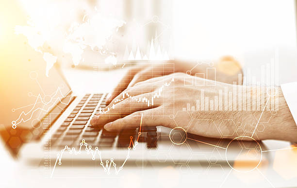 istock Laptop with business graphs toning 589444922