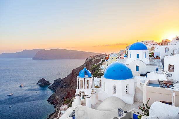 istock Oia at sunset, Santorini island, Greece 589445664